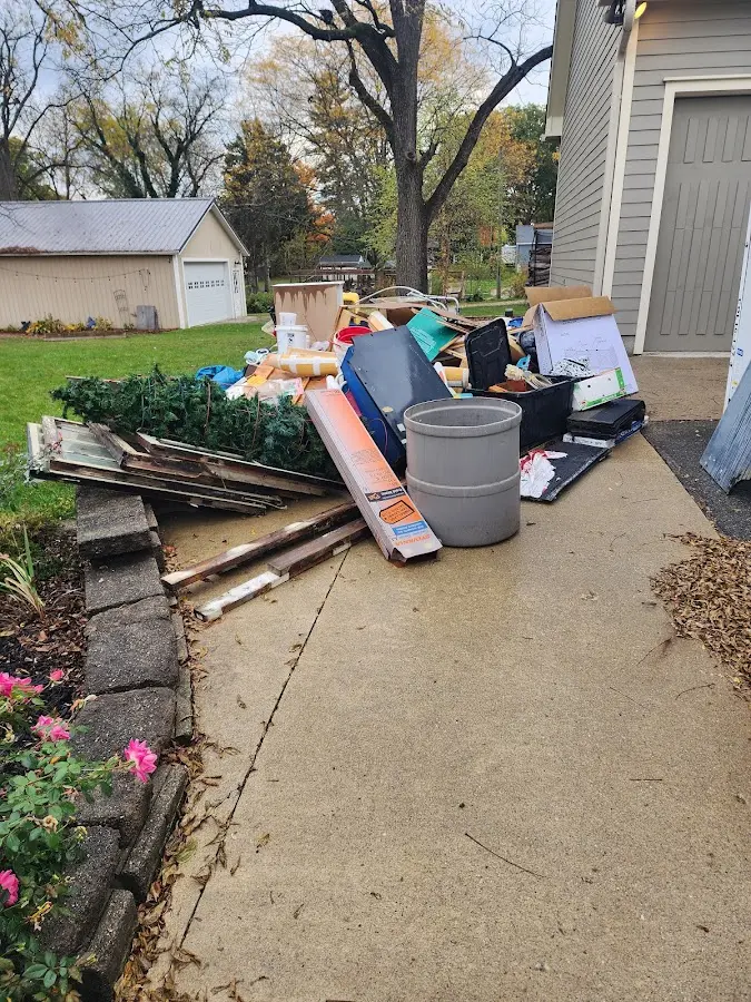 Dumpster being loaded with debris for Residential Dumpster Rental in Warrior